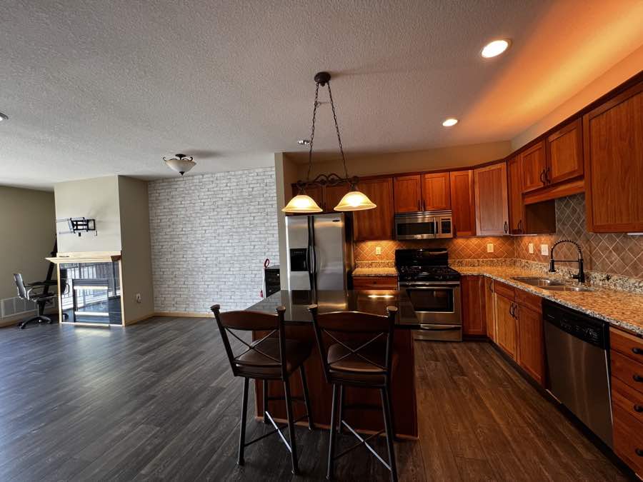 Kitchen with wood cabinetry and an island