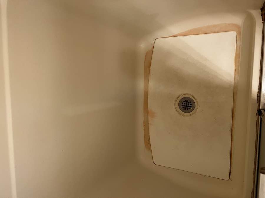 Shower base before cleaning