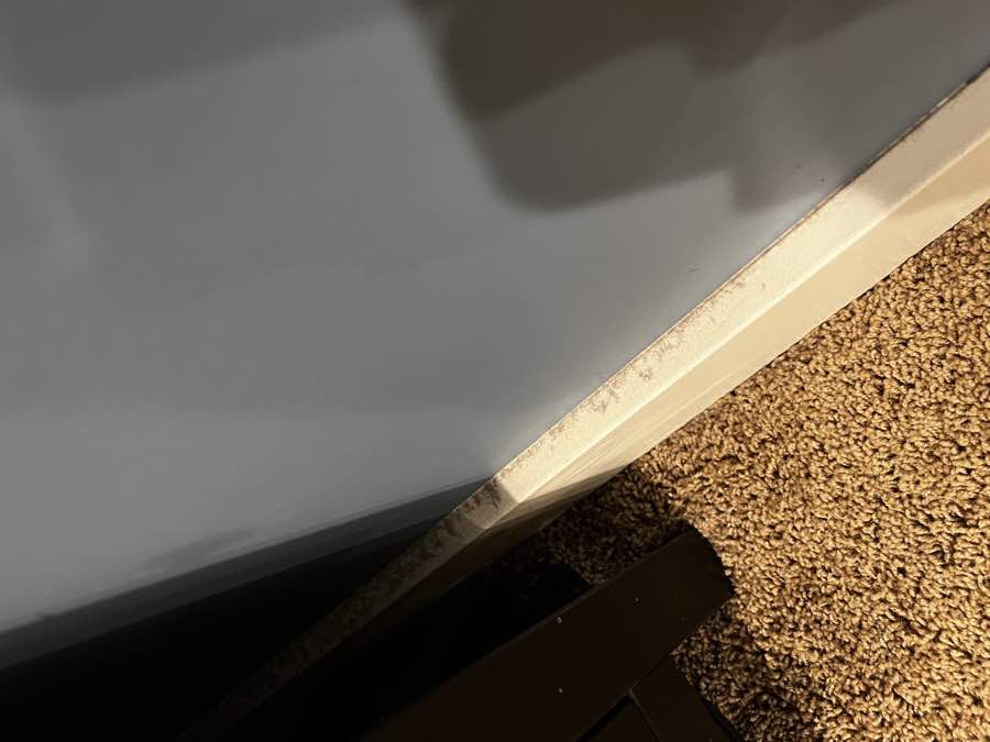 Baseboard before cleaning