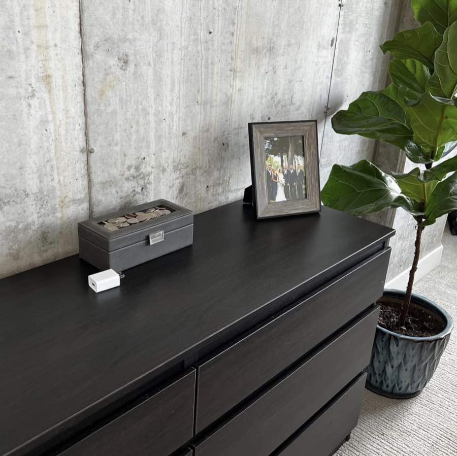 A tidy dresser and fiddle-leaf fig in a client home